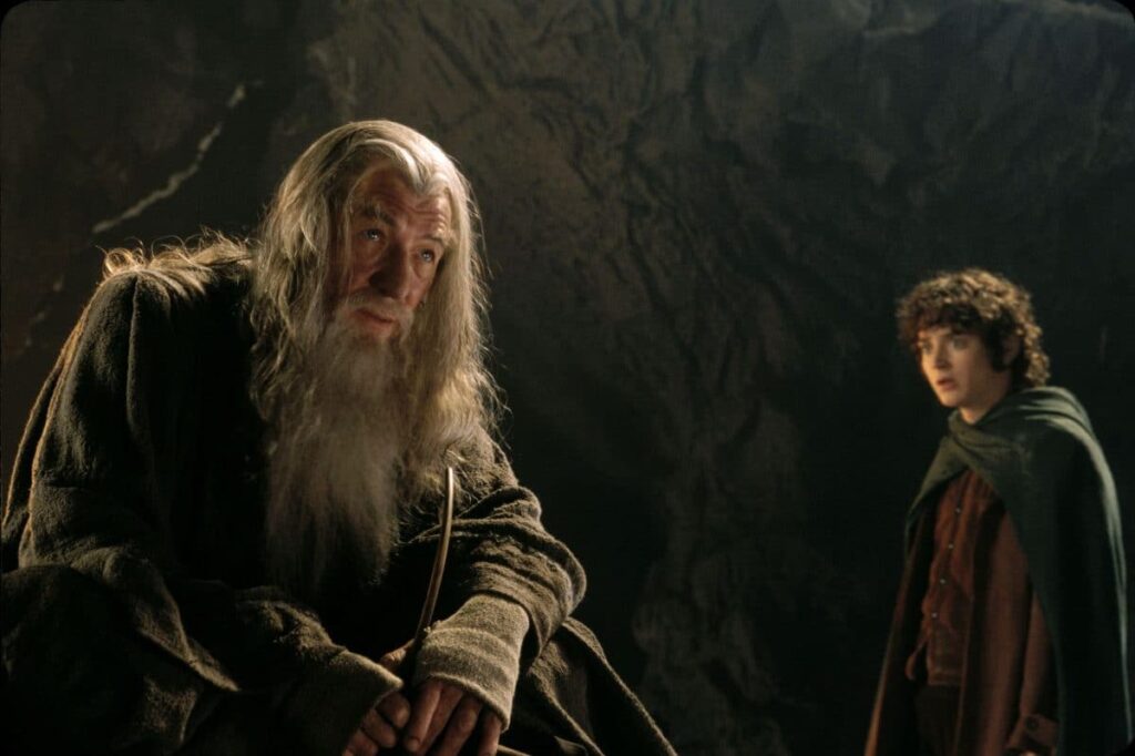 FfgTtcFXgAEE_fX-scaled.jpg - Crypto and Coin A picture of Gandalf and Frodo from the Lord Of The Rings movies