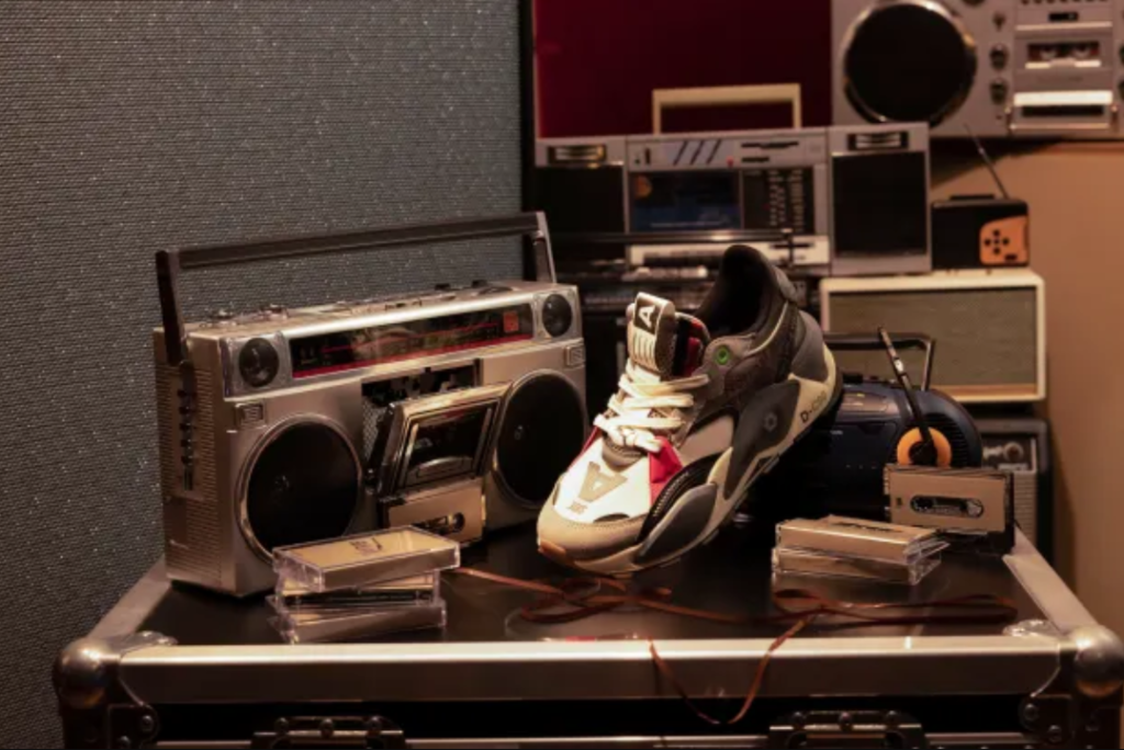 roc-nation-nft.png - Crypto and Coin image of PUMA x Roc Nation sneakers near a record player