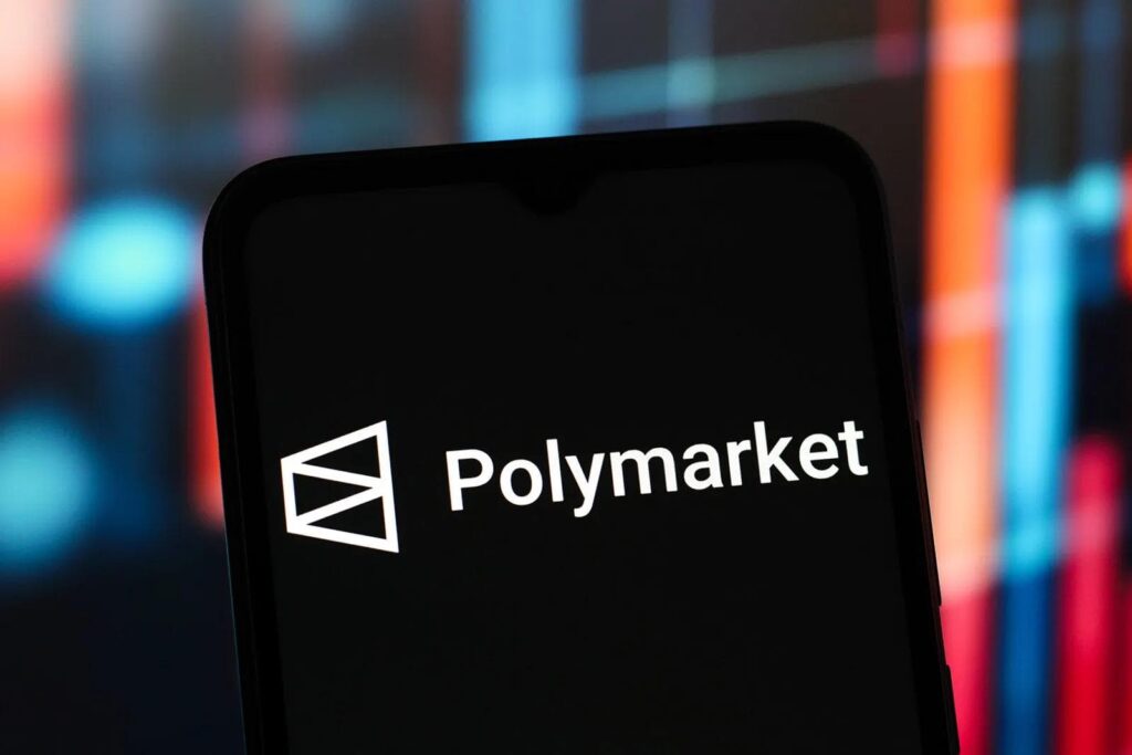 no_translation_1120_ffhaj7cer7v0iim75vzkfy4c_no_translation_translation - Crypto and Coin Polymarket logo and name on a smartphone screen with a colorful blurred background.